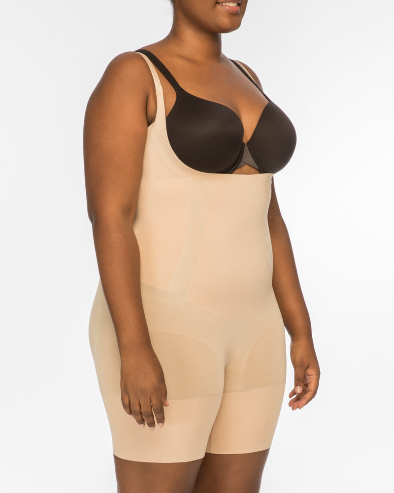 The Oncore Open-Bust Mid-Thigh Bodysuit By Spanx In Soft Nude - GINIA